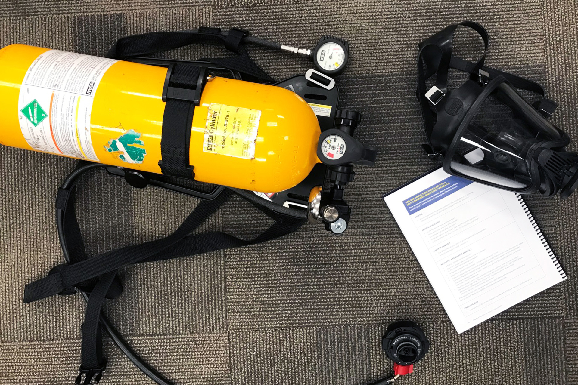 A Self-Contained Breathing Apparatus (SCBA) and a pre-use inspection checklist