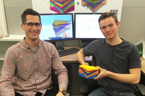 AGS geomodeller Elwyn Galloway and summer student Tyler MacCormack pose with a 3D printed Minecraft model
