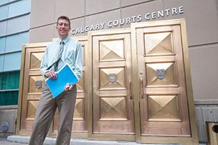 Inspector in front of courthouse