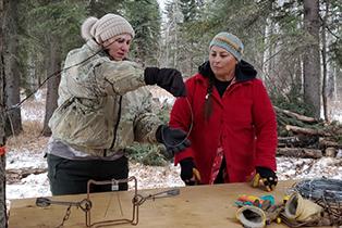 Two people operating a trapline