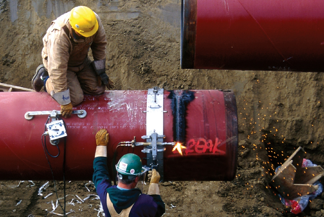 Workers repairing the pipeline