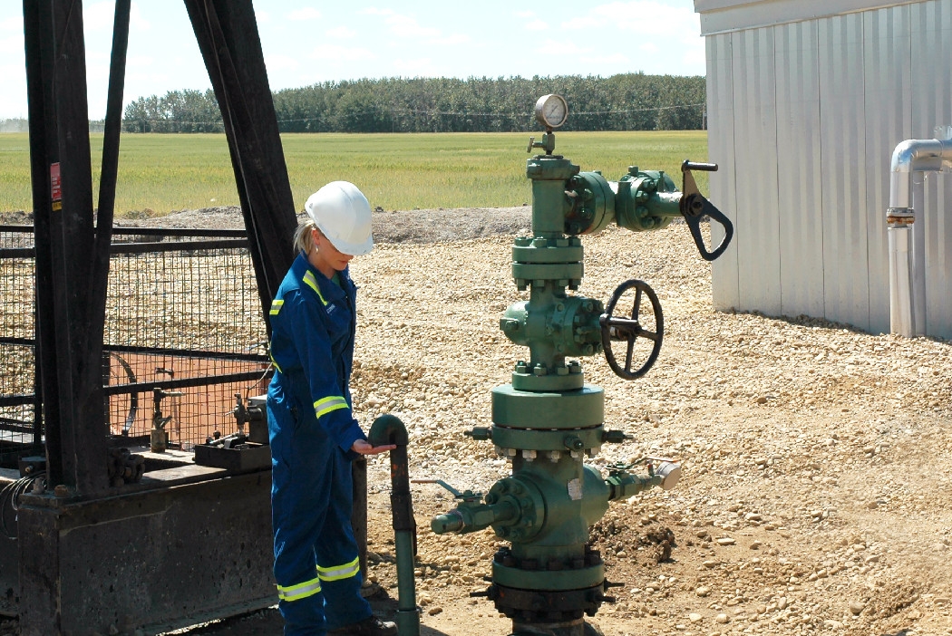Inspector checking natural gas well