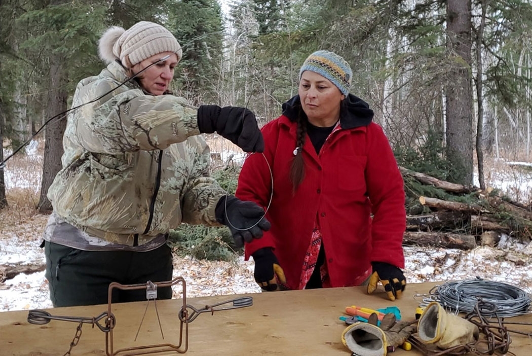 Annette sharing her trapping knowledge with a student.