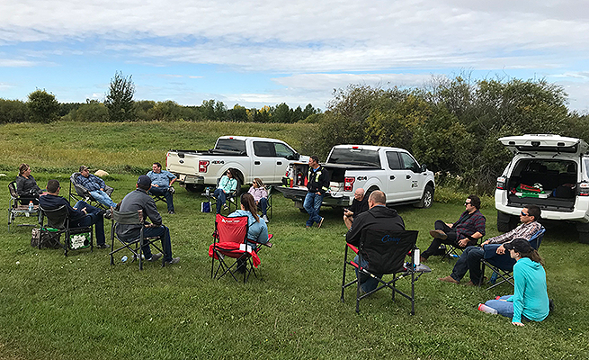 The Bonnyville FC team, hosting a literal field meeting.